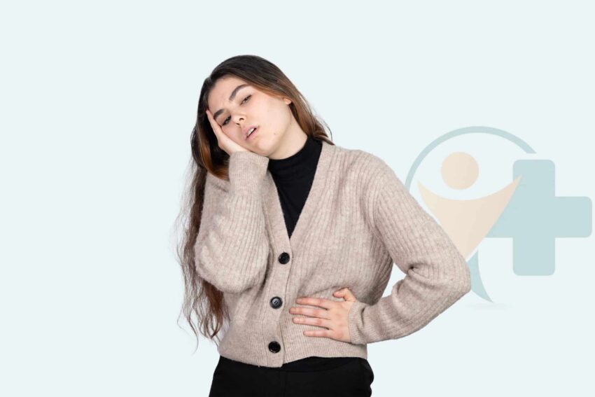 Femme souffrant de douleurs abdominales et de fatigue dues à une infection vaginale à levures, à la recherche de soulagement par un traitement antifongique.