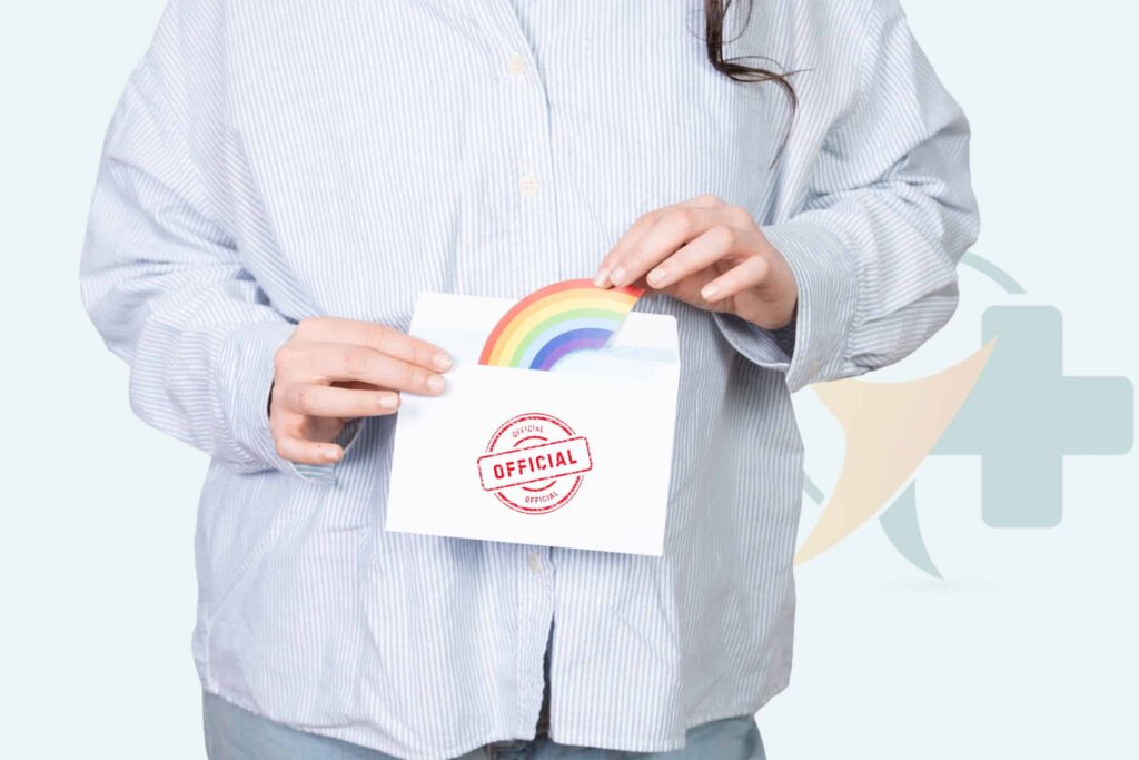 Persoană care ține un document oficial cu un simbol al curcubeului, reprezentând îngrijirea transgender supravegheată medical și terapia hormonală.