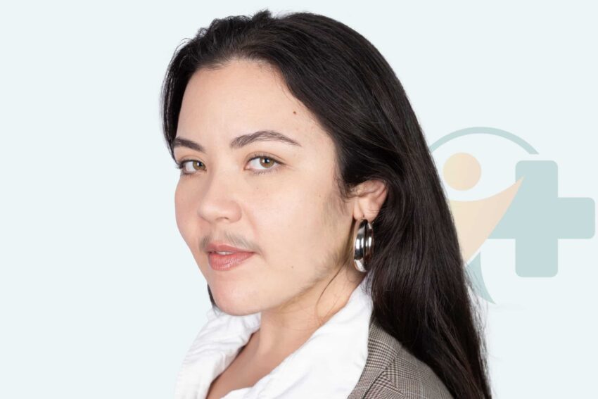 Woman with visible facial hair looking confident, representing hirsutism treatment options